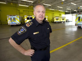 Chief Neal Roberts of the Middlesex-London Paramedic Service shows the garage in their new station located on Adelaide Street South near the 401 in London. (Mike Hensen/The London Free Press)