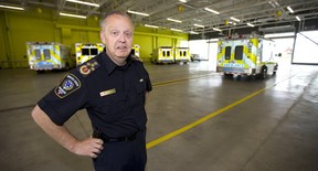 Chief Neal Roberts of the Middlesex-London Paramedic Service shows the garage in their new station located on Adelaide Street South near the 401 in London. (Mike Hensen/The London Free Press)
