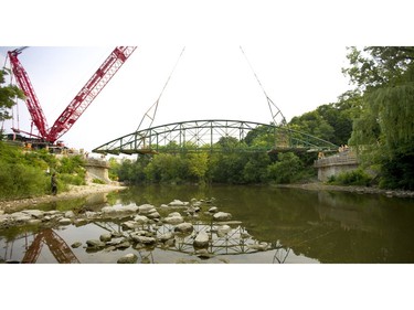 London's iconic Blackfriars Bridge is lowered onto its rebuilt footings across the north branch of the Thames River in London, Ont. on Wednesday August 15, 2018. An 800-tonne crane was used to move the stripped-down bridge into position before work to finish the structure continues. The bridge is expected to be open for traffic in November. Mike Hensen/The London Free Press/Postmedia Network