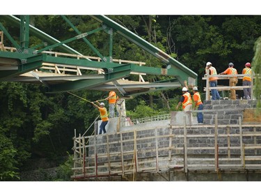 London's iconic Blackfriars Bridge is lowered onto its rebuilt footings across the north branch of the Thames River in London, Ont. on Wednesday August 15, 2018. An 800-tonne crane was used to move the stripped-down bridge into position before work to finish the structure continues. The bridge is expected to be open for traffic in November. Mike Hensen/The London Free Press/Postmedia Network