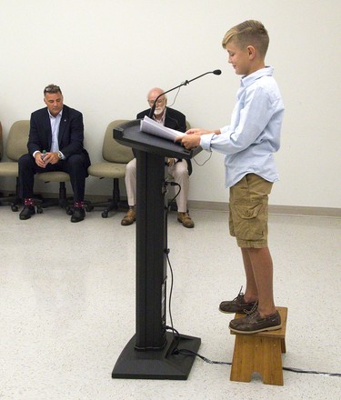 After Eric Lindros and Dr. Michael Strong addressed media to announce that the NHLPA Challenge raised $3.125 million for concussion research,  eleven-year-old Sheldon Geerts needed a  stool to reach the microphone to speak about his experiences with concussions Thursday at Western University. (Derek Ruttan/The London Free Press)