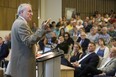 Former NHL goaltender Ken Dryden addresses hundreds, including Eric Lindros in the front row, at the See The Line concussion symposium at Western University in London on Thursday. 
(Derek Ruttan/The London Free Press)