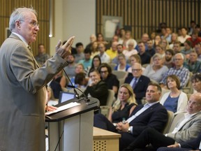 Former NHL goaltender Ken Dryden addresses hundreds, including Eric Lindros in the front row, at the See The Line concussion symposium at Western University in London on Thursday. 
(Derek Ruttan/The London Free Press)