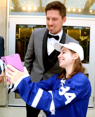 Logan Couture poses for a selfie with Eden Kleinschroth at his All in for Brain Research charity casino night at Centennial Hall in London Thursday.  Mike Hensen/The London Free Press/Postmedia Network
