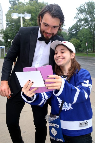 Drew Doughty poses for a selfie with Eden Kleinschroth as he arrives for Logan Couture's All in for Brain Research charity casino night at Centennial Hall in London Thursday.  Mike Hensen/The London Free Press/Postmedia Network