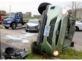 Traffic southbound on Wellington Road was backed up Friday afternoon after a rollover collision just north of Wilkens left two southbound lanes blocked by emergency vehicles and tow trucks in London, Ont.  (MIKE HENSEN, The London Free Press)