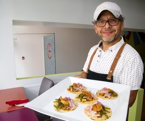 Marvin Rivas of Che shows off his shrimp creations. (Mike Hensen/The London Free Press)