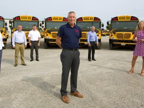 School bus operators (l-r): Janice White of First Student Canada, Rob Murphy of Murphy Bus Lines, John Prendergast of Sharp Bus Lines, Les Cross of Elgie Bus Lines, Kevin Langs of Langs Bus Lines, Theresa Matthews of Voyageur Bus Lines and Neil Badder of Badder Bus. (Mike Hensen/The London Free Press)