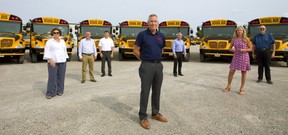 School bus operators (l-r): Janice White of First Student Canada, Rob Murphy of Murphy Bus Lines, John Prendergast of Sharp Bus Lines, Les Cross of Elgie Bus Lines, Kevin Langs of Langs Bus Lines, Theresa Matthews of Voyageur Bus Lines and Neil Badder of Badder Bus. (Mike Hensen/The London Free Press)