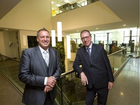 James Smith, the chair of Fanshawe's school of tourism, hospitality and culinary arts and Jim Edwards,  Fanshawe's chair of the school of information technology, show off their new campus building at 130 Dundas St.  (MIKE HENSEN, The London Free Press)