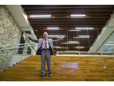 Fanshawe College president Peter Devlin shows off the amphitheatre at the new downtown campus in the former Kingmills department store. Original wooden ceiling beams and yellow brick walls were incorporated into the new building. Derek Ruttan/The London Free Press
