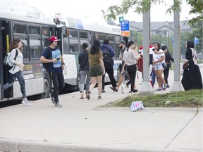London Transit Commission is asking city hall to boost its annual budget by 4.3 per cent, or about $1.3 million. Here, transit riders navigate the system at Masonville Place on Monday. (Derek Ruttan/The London Free Press)