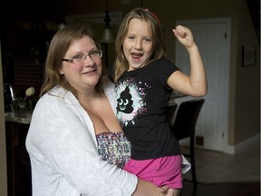 Kara Ford and daughter Kailyn, 7, are happy school bus service will not be disrupted. Derek Ruttan/The London Free Press