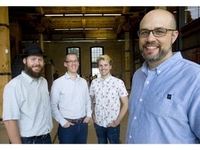 Dave Billson, right, of RH Accelerator with Gerry Geurts, left, of Curlingzone, David Uram and Cameron Arsksey of Factory Bucket in London. (Mike Hensen/The London Free Press)