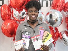 Fanshawe Student Union president Jahmoyia Smith shows off some pamphlets for mental health services available on Fanshawe's London campus. Smith encourages students to talk to somebody about their mental health because they are not alone. (SHANNON COULTER, The London Free Press)