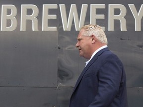 Ontario Premier Doug Ford arrives for the for the buck-a-beer plan announcement at Barley Days brewery in Picton, Ont., on Tuesday Aug. 7, 2018.