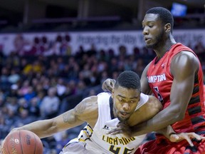 Marvin Phillips of the London Lightning tries to move the bulk of Brampton's Amardi Richard during their game at Budweiser Gardens in London, 2015. (File photo)
