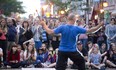 A street performer gets a round of applause from an appreciative audience during Nuit Blanche on Dundas Street in London, 2015. (File photo)