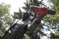 Someone has sprayed red paint on the Sir. John A. Macdonald statue in Victoria Park in Regina this week. (TROY FLEECE /Postmedia Network)