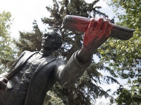 Someone has sprayed red paint on the Sir. John A. Macdonald statue in Victoria Park in Regina this week. (TROY FLEECE /Postmedia Network)