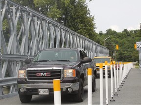 The long-awaited temporary Port Bruce bridge opened to traffic Monday nearly six months after the Imperial Road bridge collapsed. The single-lane bridge project cost Elgin County about $1.5 million and connects Dexter Line with Bank Street across Catfish Creek. (LAURA BROADLEY, Times-Journal)