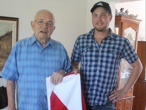 Gerald Hanley, left, and his nephew Stuart Hanley hold the flag that was draped over the casket of their uncle Private Henry Edmonds Priddle, who died 101 years ago in World War One. Priddle’s remains were found recently and transferred to the CWGC Loos British Cemetery in Loos-en-Gohelle, France on Aug. 23 with Gerald and Stuart in attendance. (LAURA BROADLEY, Times-Journal)