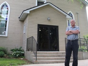Bryan Prince, a descendant of the original settlers of North Buxton, stands in front of a 19th-century chapel in North Buxton, that is the subject of a court battle between the North Buxton Community Church and the British Methodist Episcopal Church of Canada. (Ellwood Shreve/Postmedia Network)