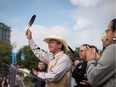 Coldwater Indian band Chief Lee Spahan raises an eagle feather after responding to a Federal Court of Appeal ruling on the Kinder Morgan Trans Mountain Pipeline expansion, during a news conference in Vancouver, on Thursday August 30, 2018. In a unanimous decision by a panel of three judges, the court says the National Energy Board's review of the project was so flawed that the federal government could not rely on it as a basis for its decision to approve the expansion.