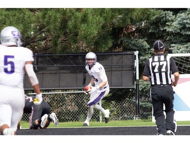 Western Mustangs receiver Harry McMaster scores a third-quarter touchdown after taking a pass from QB Chris Merchant during an Ontario University Athletics football regular-season game against the Carleton Ravens at Carleton's MNP Park on Sunday. Western won the game 26-23 in overtime. Valerie Wutti/Carleton Ravens