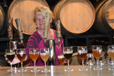 Frezi Bouckaert sets up a row of craftbeer for visitors to try from the barrels of Purpose Brewing.

BARBARA TAYLOR/THE LONDON FREE PRESS