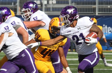 Western Mustangs running back Cedric Joseph rushed for 118 yards and a touchdown in Western's 26-23 win over the Queen's Gaels Saturday in Kingston. (Ian MacAlpine/The Whig-Standard)