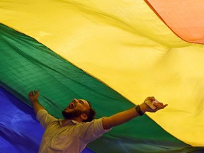 A member of India's lesbian, gay, bisexual, transgender (LGBT) community in Mumbai celebrates the Supreme Court decision to strike down a colonial-era ban on gay sex, on Sept. 6. India's Supreme Courtstruck down the ban that has been at the centre of years of legal battles. "The law had become a weapon for harassment for the LGBT community," Chief Justice Dipak Misra said as he announced the landmark verdict. (Indranil Mukherjee/ AFP/Getty Images)