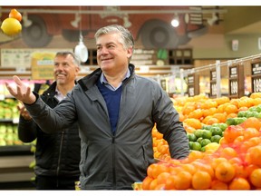Farm Boy CEO's Jean Louis Bellemare and Jeff York (right) tour around their new store on McRae in Ottawa - part of an aggressive expansion of the grocery store whose origins started in Cornwall in 1981.