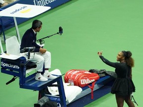 Serena Williams argues with chair umpire Carlos Ramos while playing Naomi Osaka of Japan during the 2018 U.S. Open women's singles final match on Sept. 8, 2018 in New York. (Kena Betancur / AFP)