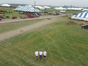 David Murray, president of the Ontario Plowmen's Association, centre, is shown with 2018 International Plowing Match & Rural Expo co-chairs Leon Leclair, left, and Darrin Canniff, right, at the event site in Pain Court, Ont. (Trevor Terfloth/The Daily News)