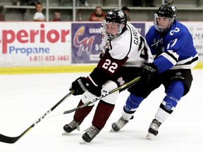 Chatham Maroons' Nolan Gardiner (22) is checked by London Nationals' Cal Davis (17) in the third period at Chatham Memorial Arena in Chatham, Ont., on Sunday, Sept. 23, 2018. Mark Malone/Chatham Daily News/Postmedia Network
