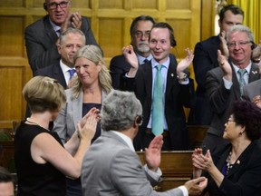 Ontario MP Leona Alleslev is applauded as she stands to ask a question during question period in the House of Commons on Parliament Hill in Ottawa on Monday, Sept. 17, 2018. Alleslev crossed the floor from the Liberals to the Conservatives prior to Question Period. THE CANADIAN PRESS/Sean Kilpatrick