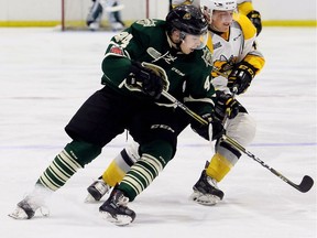 London Knights' Ryan Bangs, left, battles Sarnia Sting's Jacob Perreault in an OHL preseason game in Sarnia, on Saturday, Sept. 1, 2018. (Mark Malone, Postmedia Network)