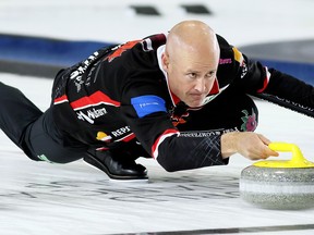 Skip Kevin Koe of Calgary throws a rock during the seventh draw at the Grand Slam of Curling's Princess Auto Elite 10 at Thames Campus Arena in Chatham on Friday, Sept. 28, 2018. Koe clinched a playoff berth with a 3-and-1 win over Scotland's Ross Paterson. Mark Malone/Postmedia Network