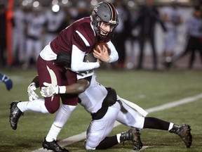 Safety Devonte Ballantyne of CCH makes an open field tackle on South's quarterback Ethan Martin during their WOSSAA football final in November at TD stadium. The two teams have received national recognition for their successes. (London Free Press file photo)