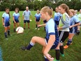 Brooklyn Oosting, centre, of the London Whitecaps 15-year-old girls works on juggling the ball during a practice in London, on Thursda.  The team is heading to the Ontario Cup on Saturday. (Mike Hensen/The London Free Press)