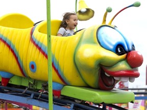 Addison Granger, 5, of Kincardine, rides the Wacky Worm roller-coaster Friday at the Western Fair. (DEREK RUTTAN, The London Free Press)