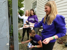 First year Western students were out and about on Saturday September 8, 2018 trying to get in touch with the community and doing charity work. (l-r) Megan Parrott, Maddy Dale, Jordan Henderson and Adina Kline paint a fence gate at London's Eldon House museum after touring the facility earlier in the day. All the students are on the same floor of the Ontario House residence at Western and were also getting to know each other at the same time. (Mike Hensen/The London Free Press)