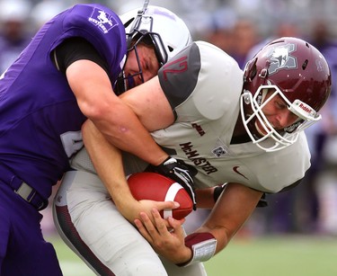 Western defensive end Andrew Thurston throws McMaster quarterback Jackson White for a three-yard loss, forcing a punt early in their home opener on Saturday September 8, 2018. 
Western won 44-6.
Mike Hensen/The London Free Press/Postmedia Network