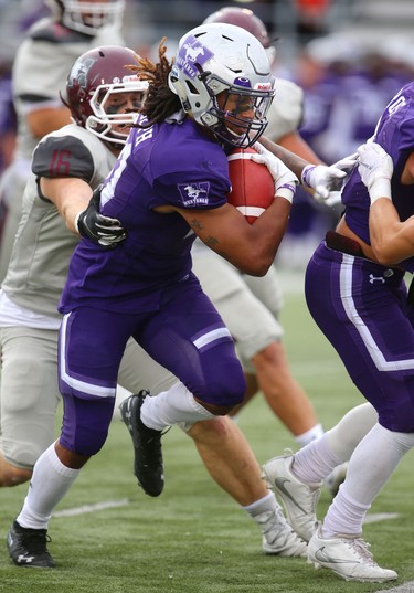 Western running back Cedric Joseph cuts back behind the blocking of slotback Cole Majoros in Western's home opener on Saturday September 8, 2018. 
Western won 44-6 over the McMaster Marauders.
Mike Hensen/The London Free Press/Postmedia Network