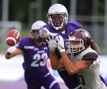 Western cornerback Bleska Kambamba comes over the top in time to knock away a pass intended for McMaster slot back Noah Griffith in Western's 44-6 home opening win over the Marauders in London, Ont. 
Photograph taken on Saturday September 8, 2018. 
Mike Hensen/The London Free Press/Postmedia Network
