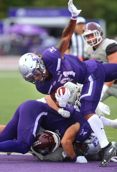 Western Mustangs running back Cedric Joseph hurdles the line again for his second touchdown in Western's 44-6 home opening win over the Marauders in London, Ont. 
Photograph taken on Saturday September 8, 2018. 
Mike Hensen/The London Free Press/Postmedia Network