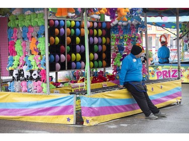 All quiet was on the Western Fair front Monday. A rainy afternoon made for some lonely game and ride operators at the fair in London. (Derek Ruttan/The London Free Press)