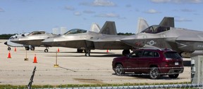 Two F-22 Raptors (left, middle) and an F-35 Lightning II wait on the tarmac at London airport after this weekend's airshow in London. Awaiting orders on where to go to avoid Hurricane Florence, the aircraft are undergoing routine maintenance under heavy security, an airshow spokesperson said. 
Mike Hensen/The London Free Press