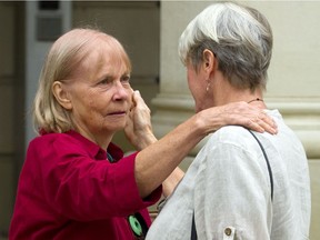 Marjorie Payne, mother-in-law of the late Sarah Payne and grandmother to Freya Payne who also died in an August 2017 401 crash near Dutton, is comforted by family member Deborah Livingstone outside of the Elgin County courthouse in St. Thomas.  Wednesday. They were in court to hear the guilty pleas of Hubert Patrick Domonchuk who had his driver's licence revoked. Domonchuk will be sentence Dec. 17.  Mike Hensen/The London Free Press